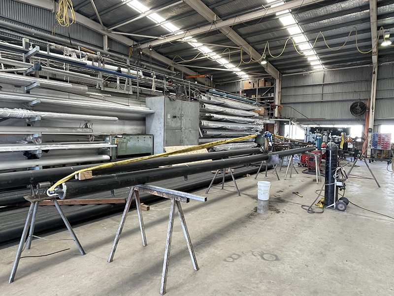 Cambering of CHS (Circular Hollow Section) Beam prior to welding out connection bracket.