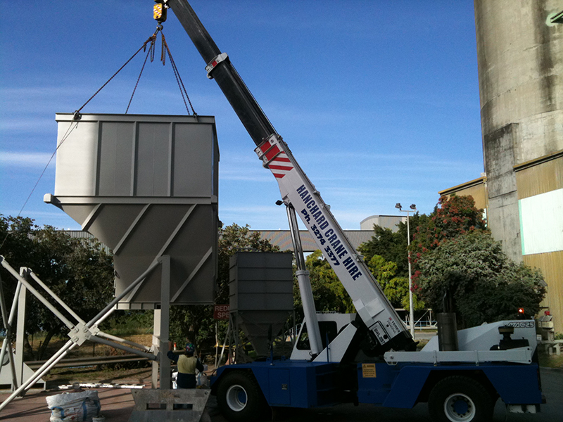 Installing the hopper onto base frame.