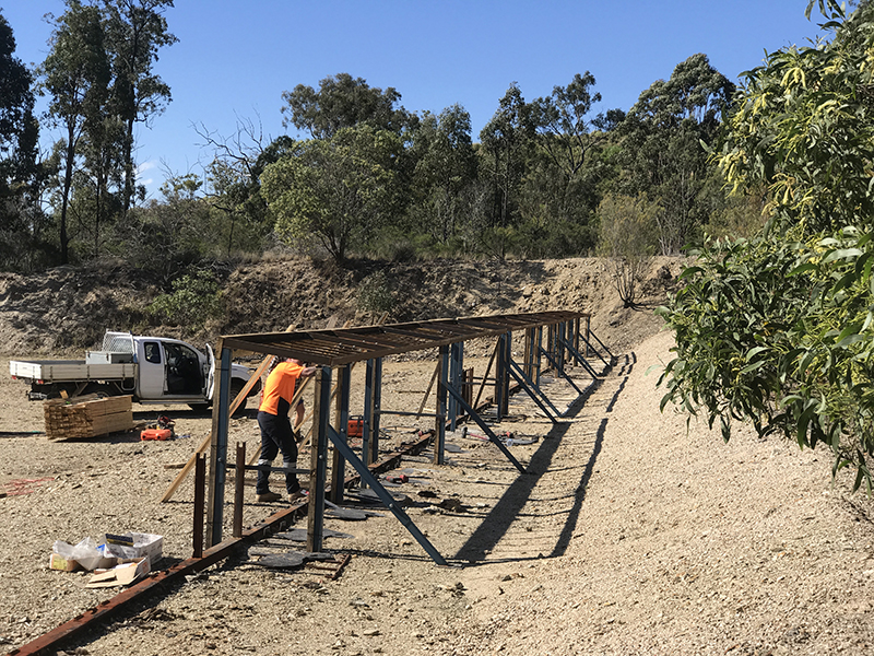 Installing shrapnel frames that were fabricated on site at a shooting range.