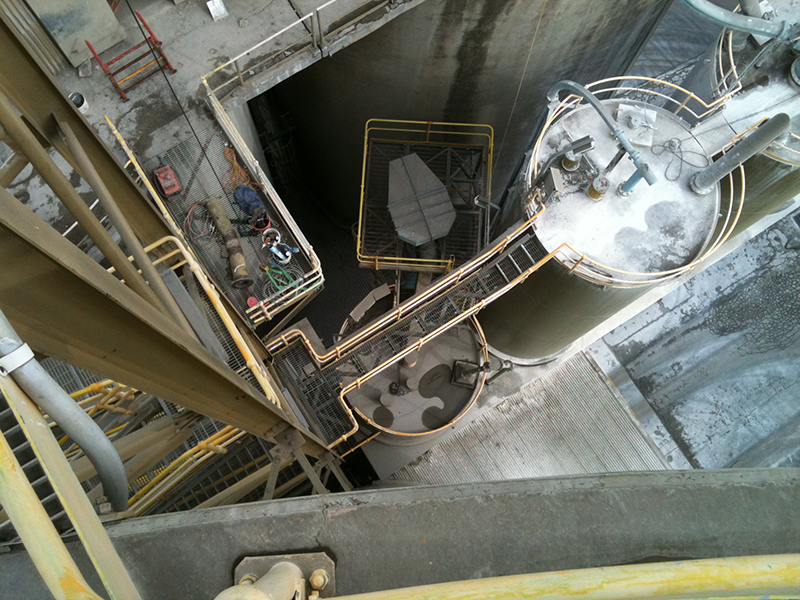 Birdseye view from top of silo doing repair work.