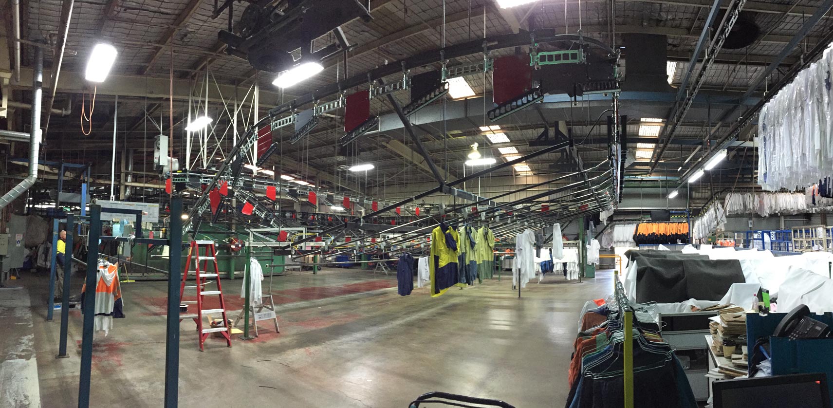 Installing a new conveyor system and slick rails in a commercial laundry.