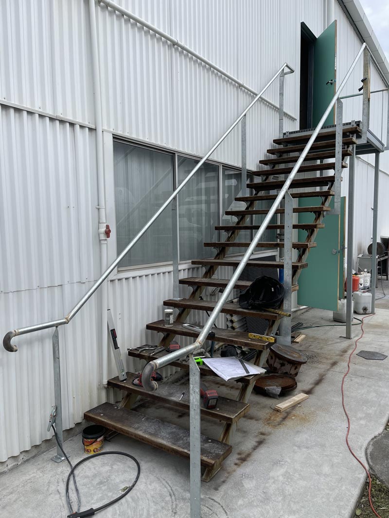Installing new handrails on stairs.